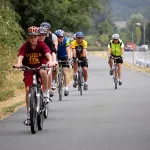 People riding bikes on a scenic route